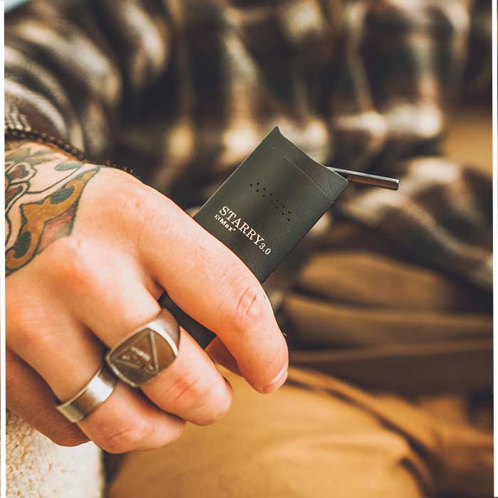 XMax Starry Portable dry herb vape in hand