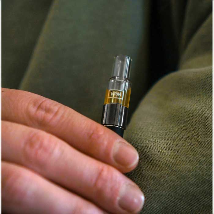 all glass oil vape cartridge in user hand