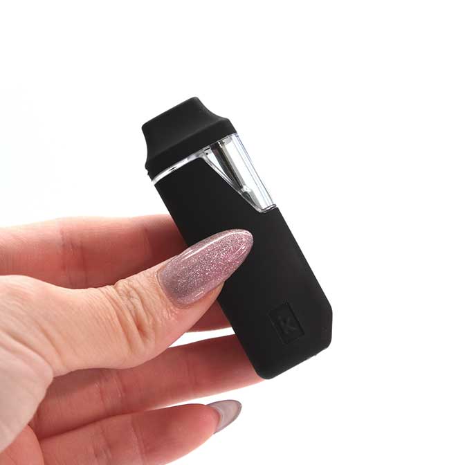 UZO Pro Rechargeable Disposable Vape Pen in hand