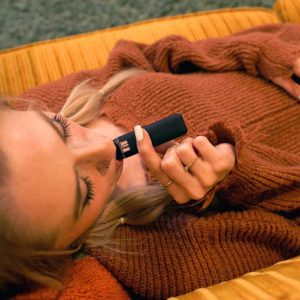 Ikrusher-Tik-Pro-Disposable-vape-oil-pen-lifestyle-photo-using-the-device